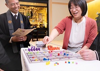 ゲームを通じてにぎやかに寺院運営を考えることができる「別院会議」=真宗大谷派提供